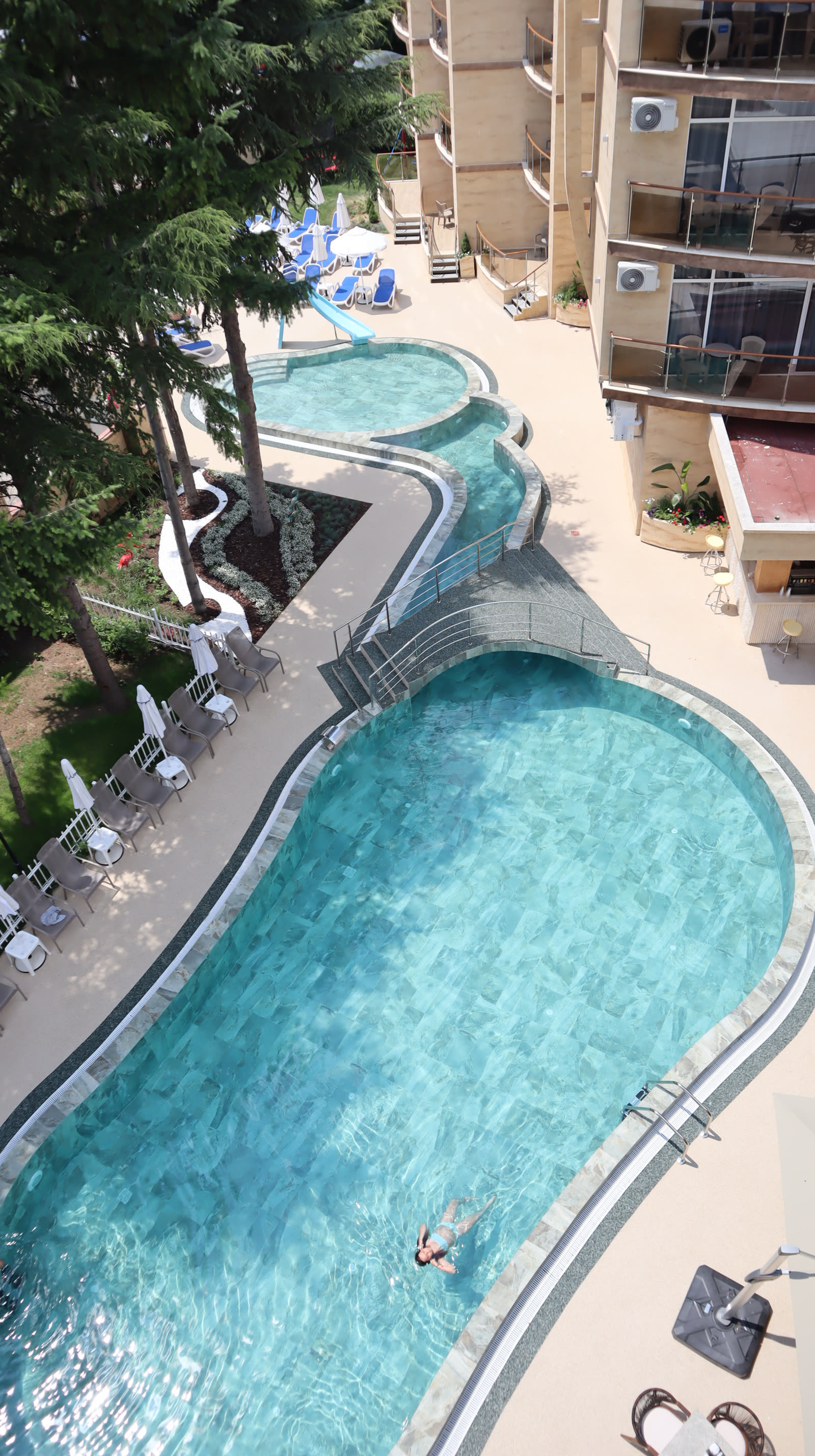 The winding outdoor pool from above